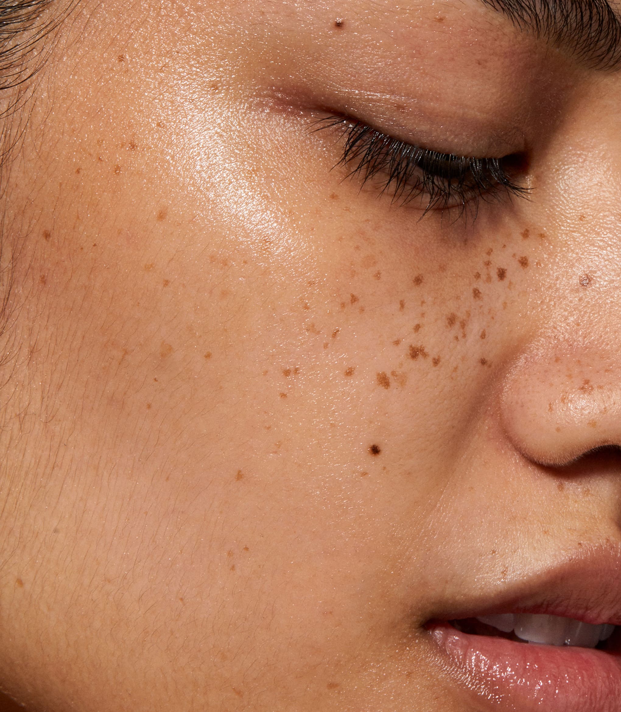 A close up of model's face with Mineral UV Shield SPF 30 applied to her skin.