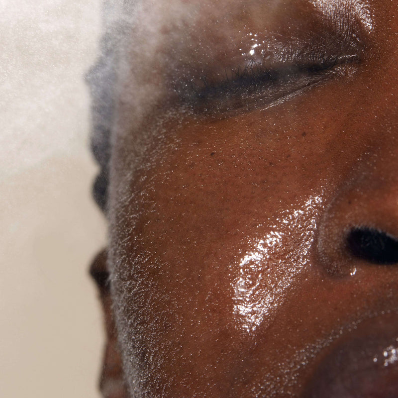 Cooling mist for instant hydration. A model spraying a mist on her face.